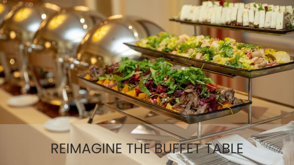 Buffet of food on shelf display and closed silver serving trays
