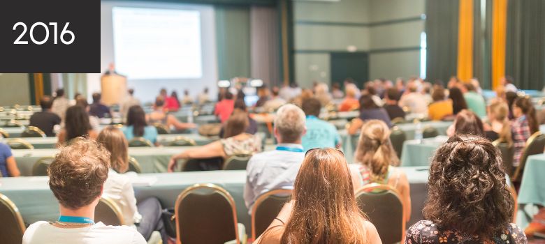 Attendees listening to a speaker