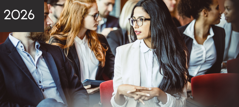 People sitting at a conference talking