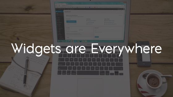Laptop, cell phone, and coffee on a desk Text: Widgets are Everywhere