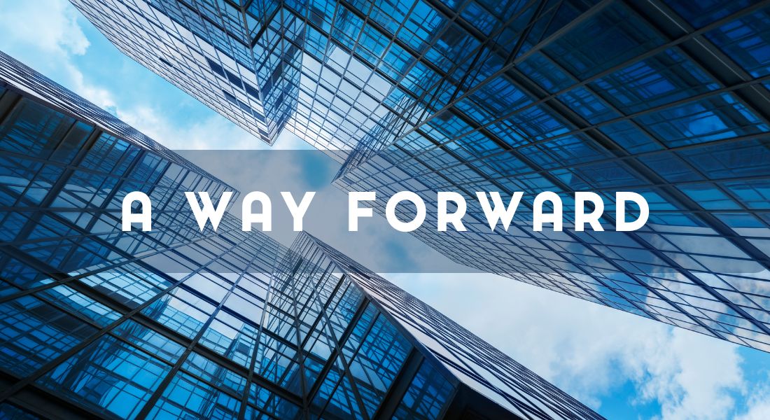 Looking up at modern skyscrapers reflecting the sky, with the text "A Way Forward" in bold capital letters across the image.